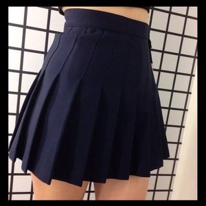 Navy pleated mini skirt